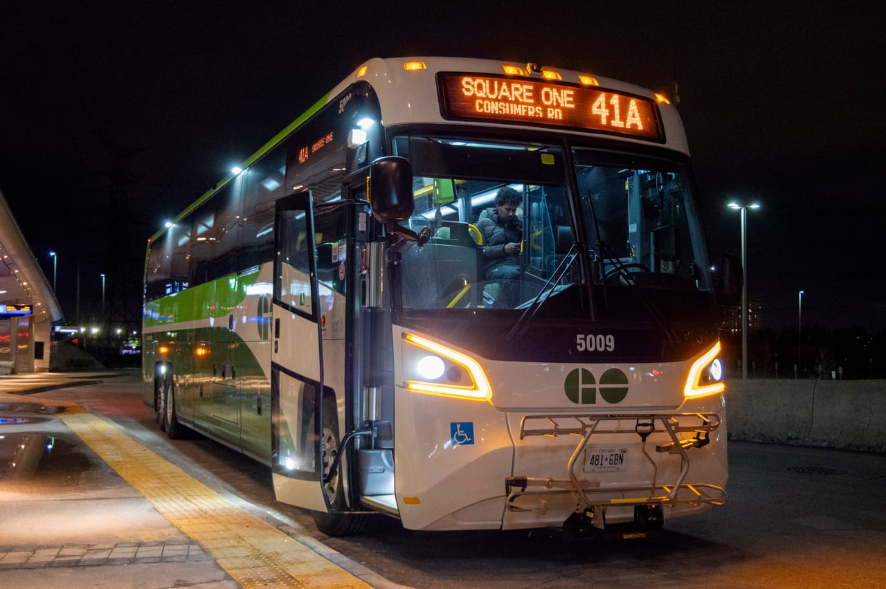 Fixed-route transit coach at night